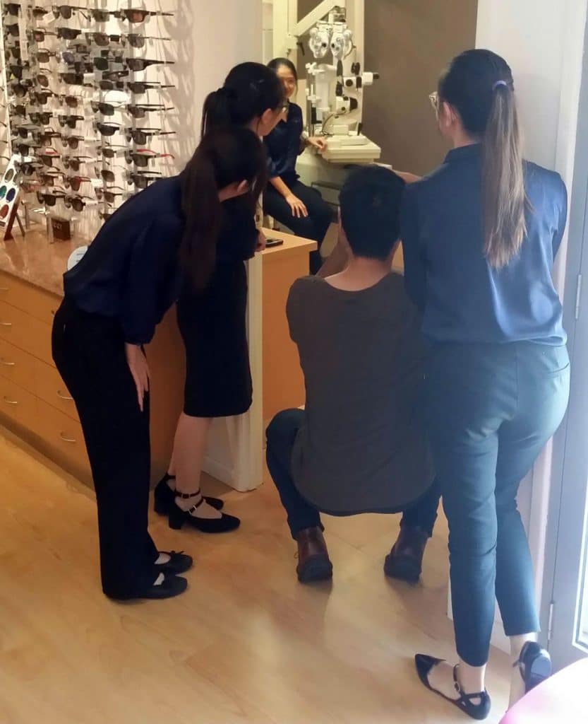 The staff peeping in our first professional photoshoot for the launch of our website.