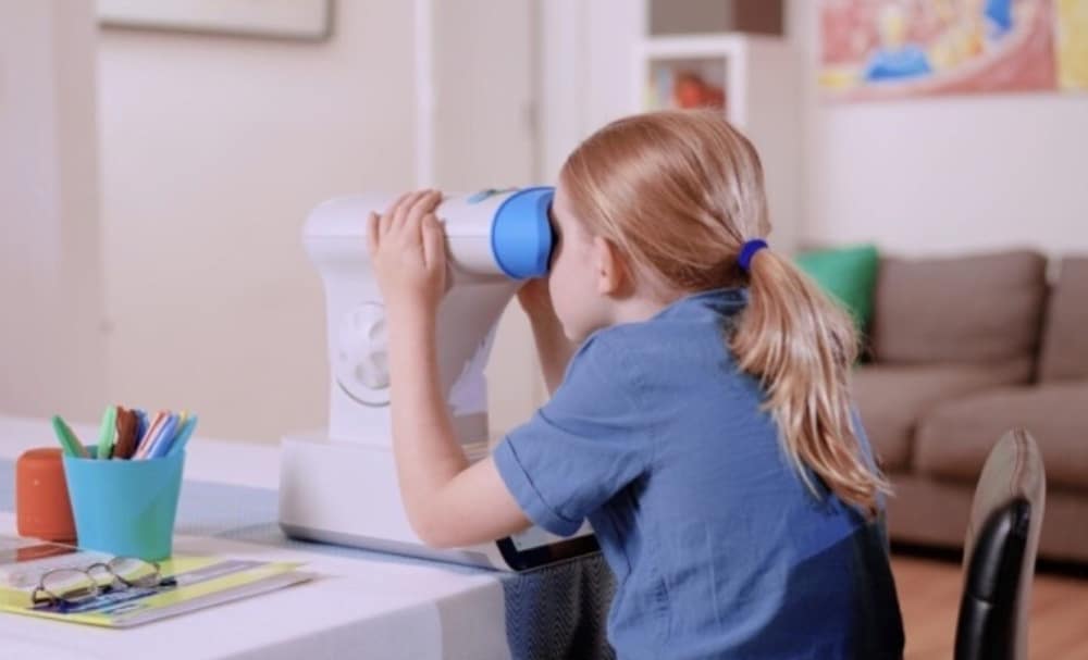 A young girl using RLRL therapy to slow down Myopia progression