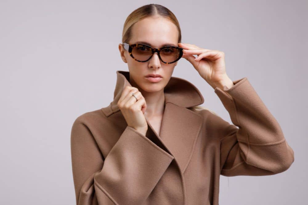 Woman wearing high end eyewear brand designer frame sunglasses