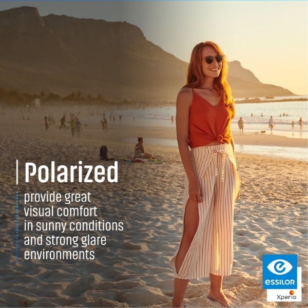 A woman wearing polarised sunglasses at the beach