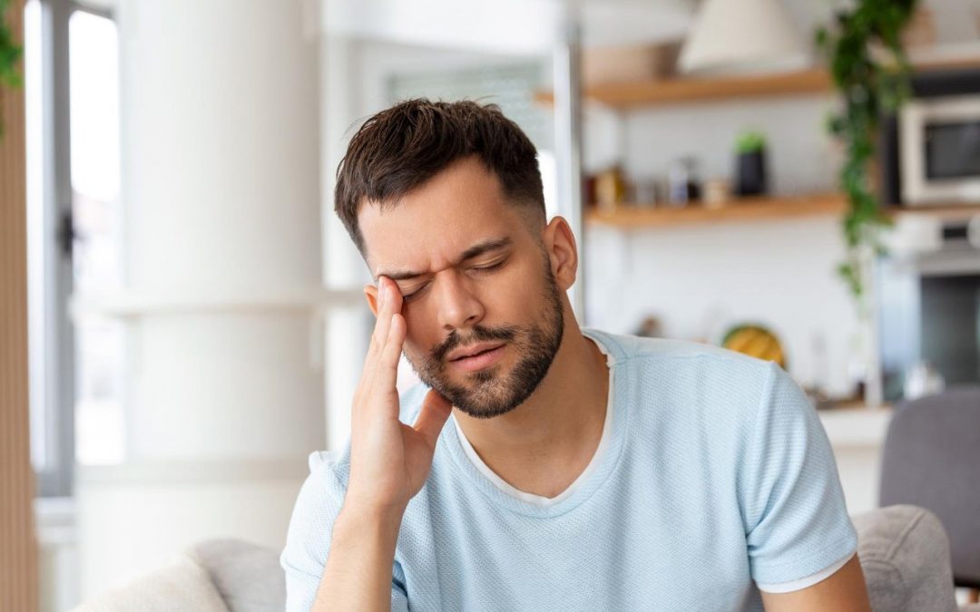 man suffering from eye allergy with sore, itchy eyes