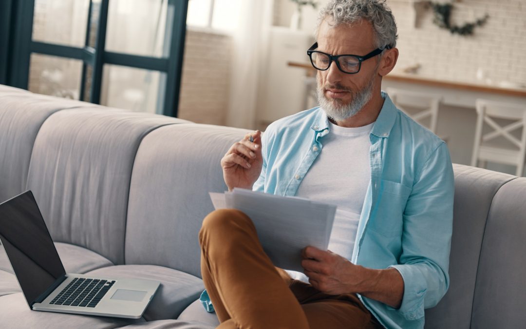 Senior man wearing glasses reading