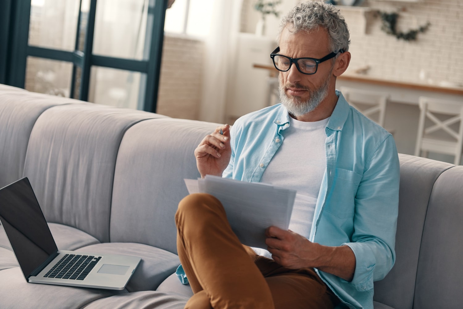 Senior man wearing glasses reading