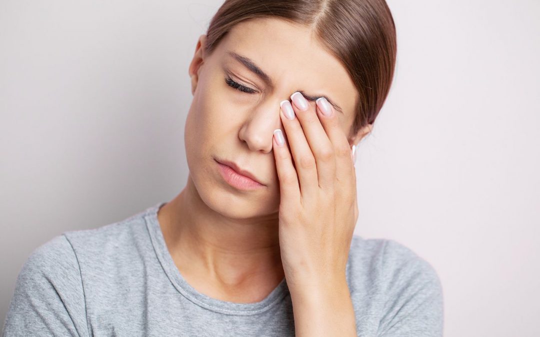 A young girl suffering from stye with irritated and swollen eye